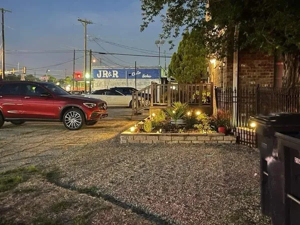 a car parked in the middle of a yard