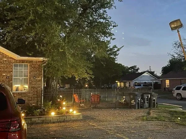 a view of swimming pool with outdoor seating and yard in the back