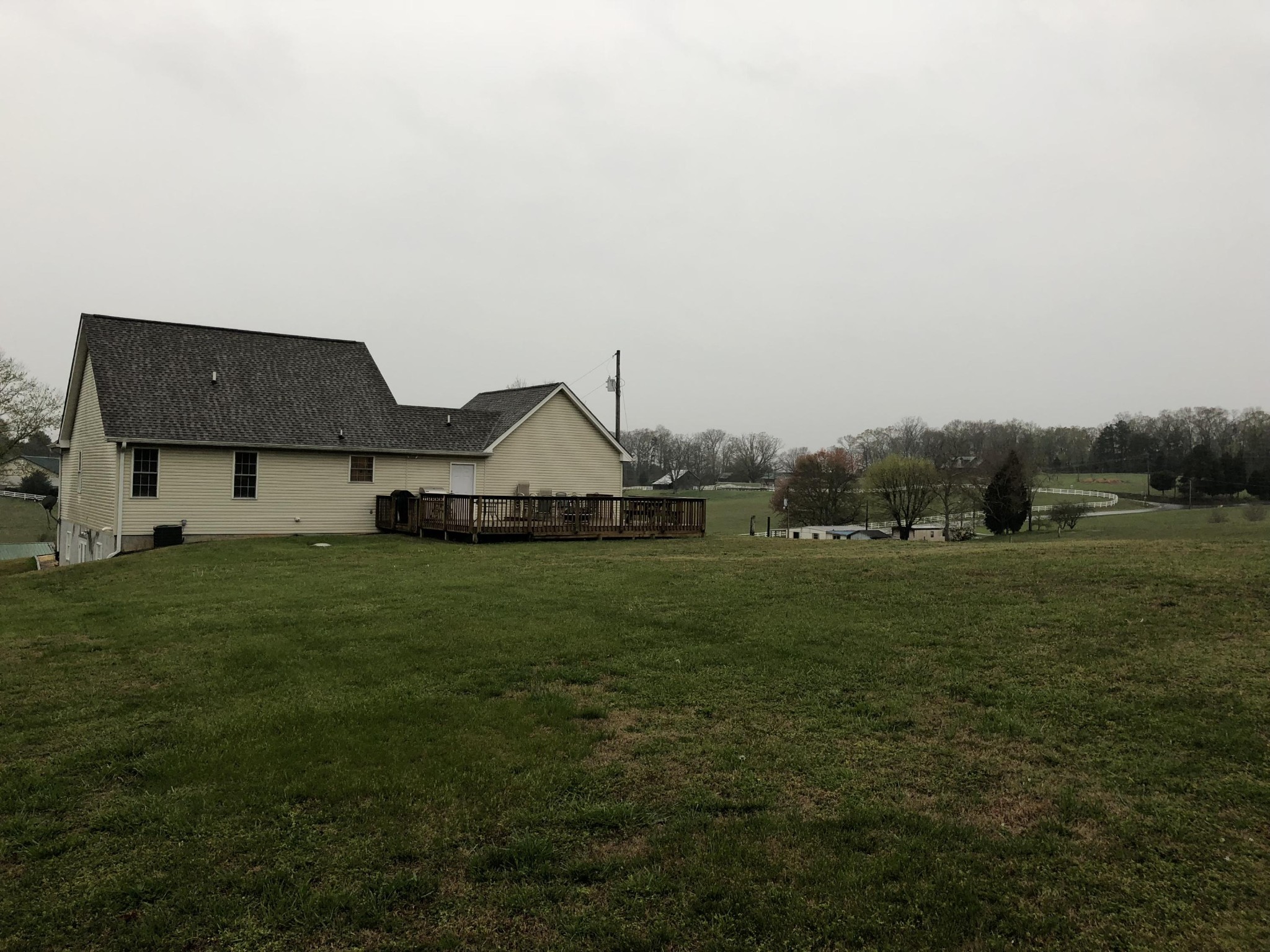 13711 Vonore Road Loudon, TN 37774 - Photo 12 of 34 a house with green field in front of it
