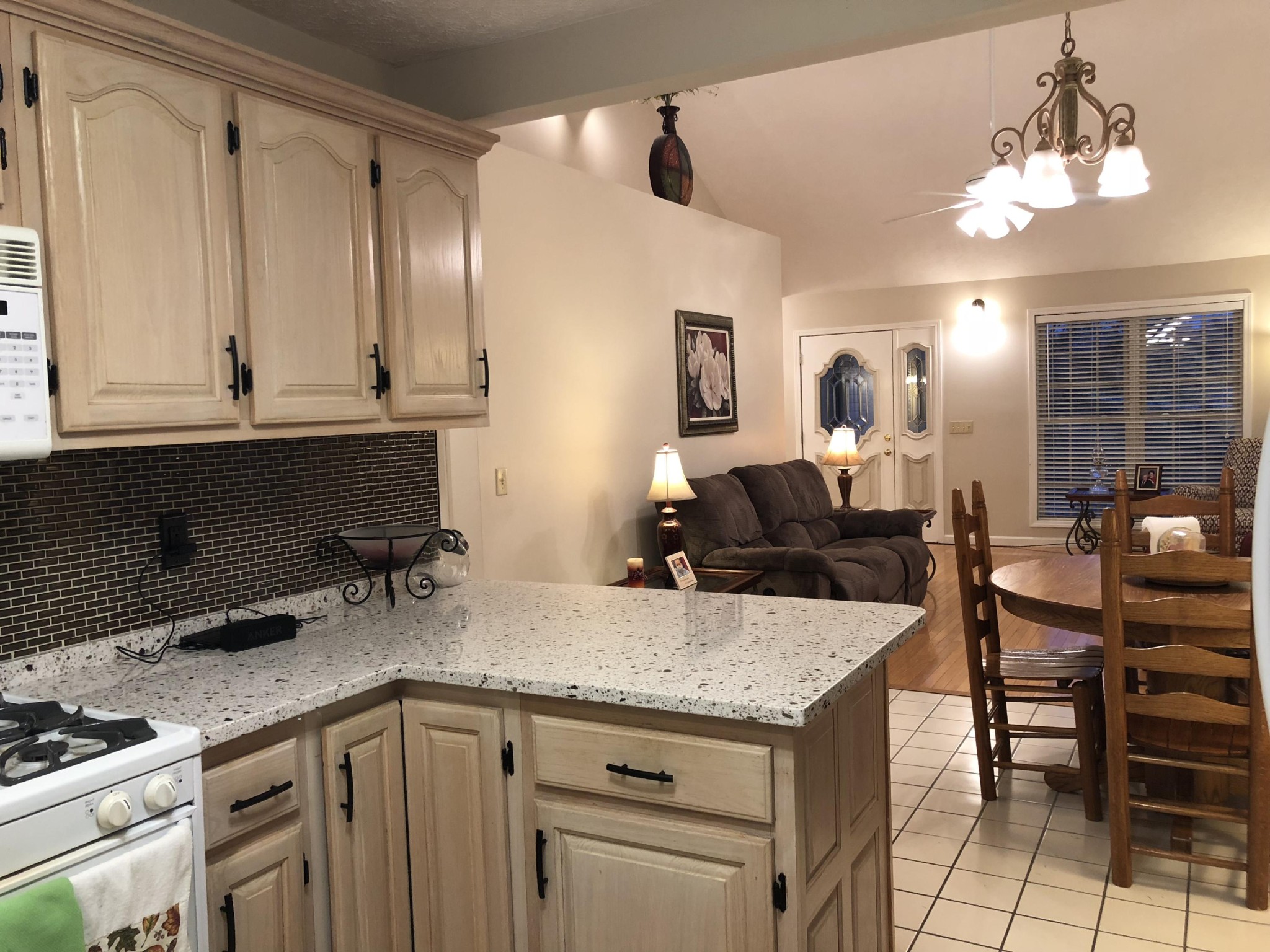 13711 Vonore Road Loudon, TN 37774 - Photo 19 of 34 a kitchen with granite countertop a sink a stove and chairs