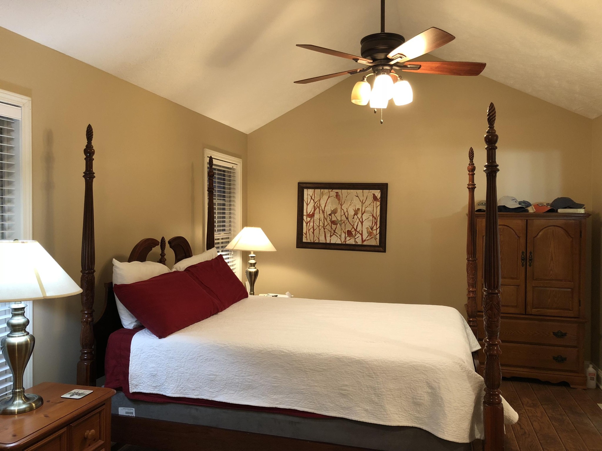 13711 Vonore Road Loudon, TN 37774 - Photo 21 of 34 a bedroom with a bed and a chandelier