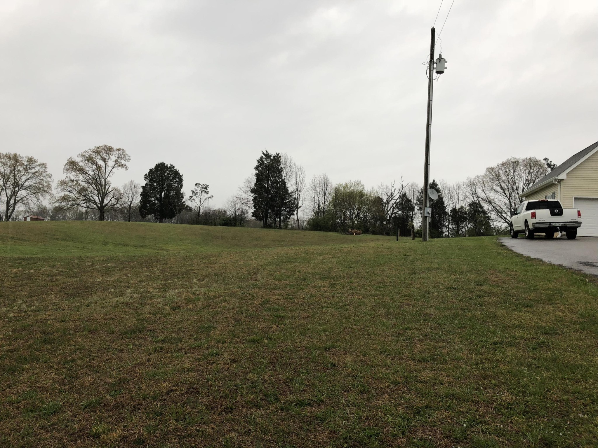 13711 Vonore Road Loudon, TN 37774 - Photo 32 of 34 a view of a grassy field with trees in the background
