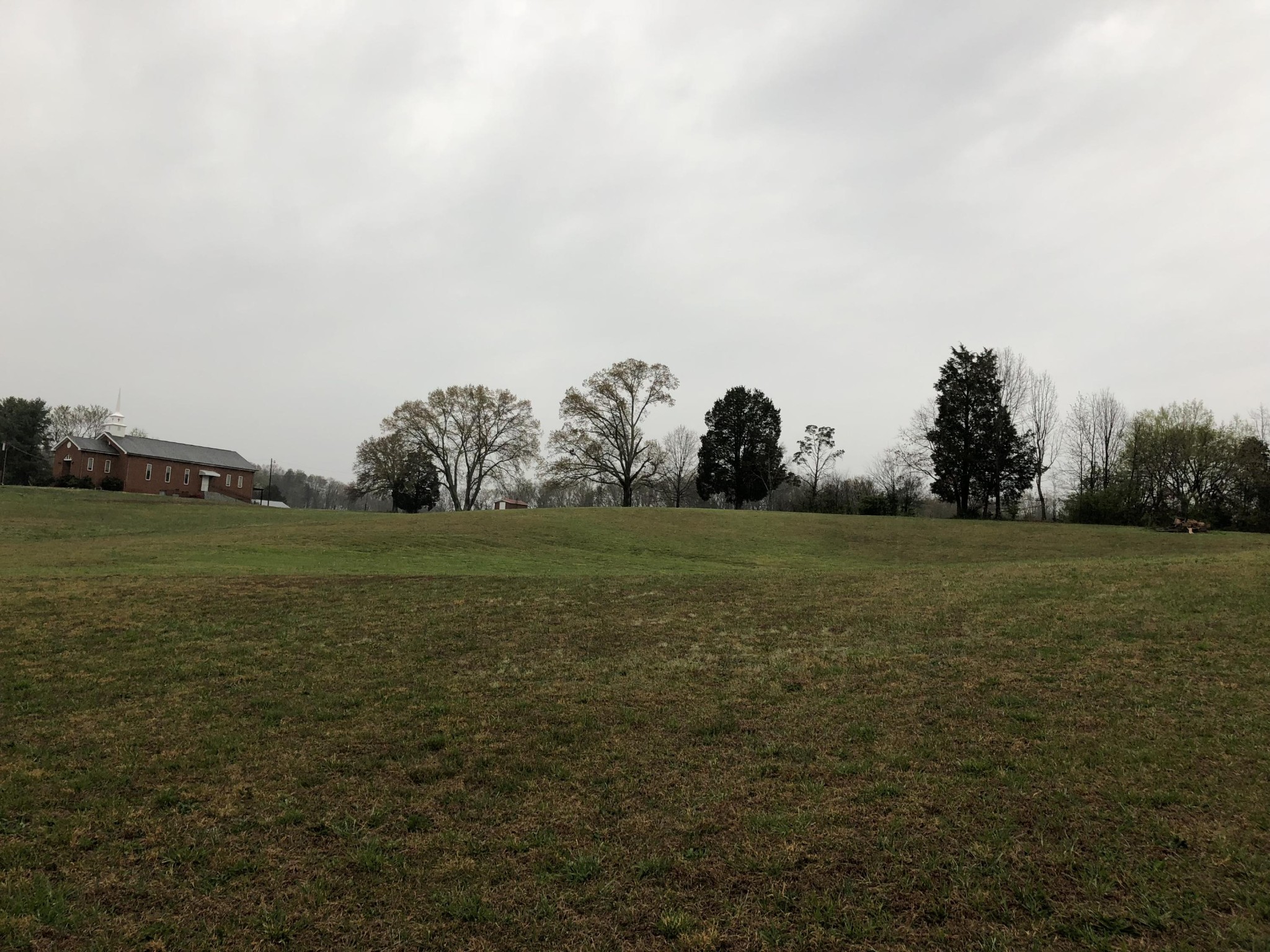13711 Vonore Road Loudon, TN 37774 - Photo 33 of 34 a view of a green field with wooden fence