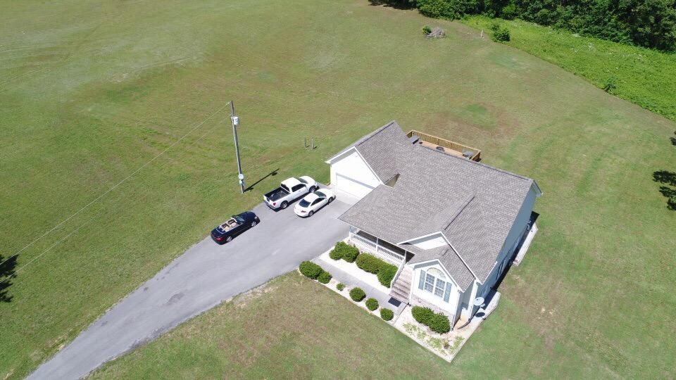 13711 Vonore Road Loudon, TN 37774 - Photo 5 of 34 an aerial view of a house with a garden