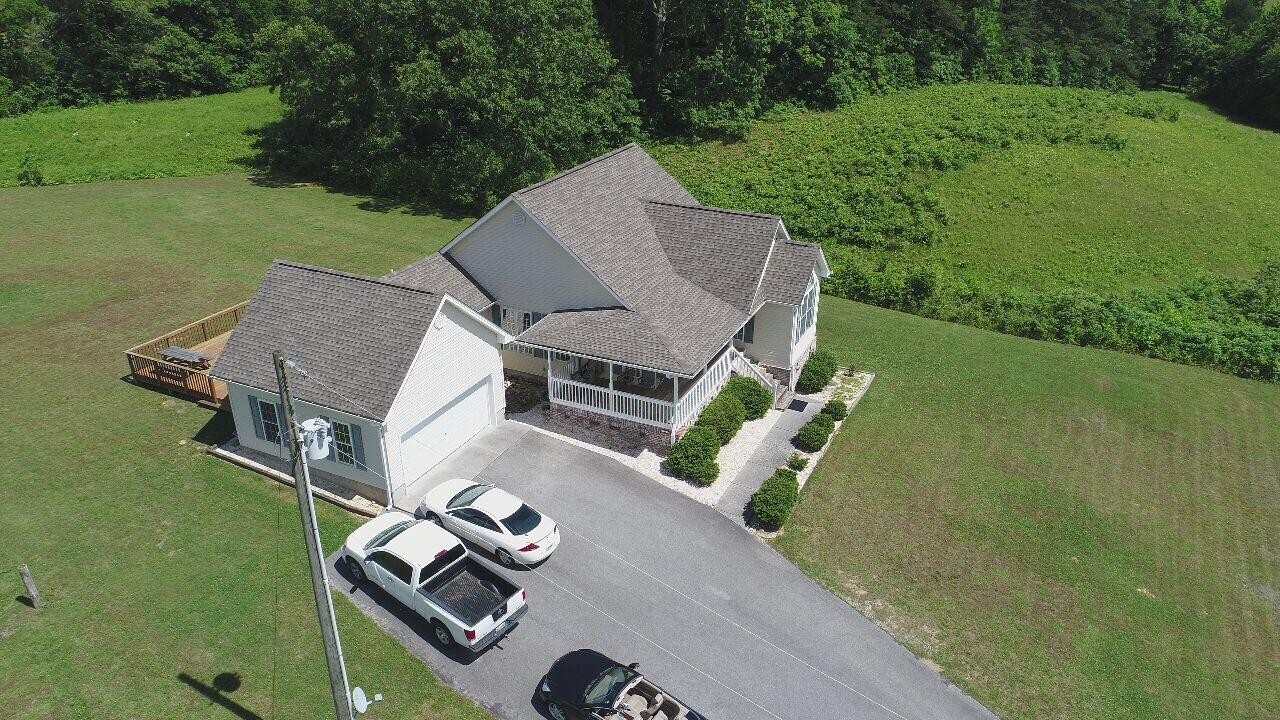 13711 Vonore Road Loudon, TN 37774 - Photo 6 of 34 an aerial view of a house with swimming pool garden and patio