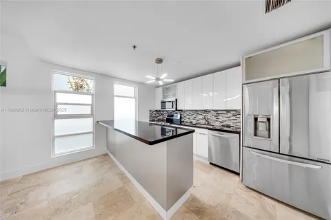 a bathroom with a sink a mirror and a shower