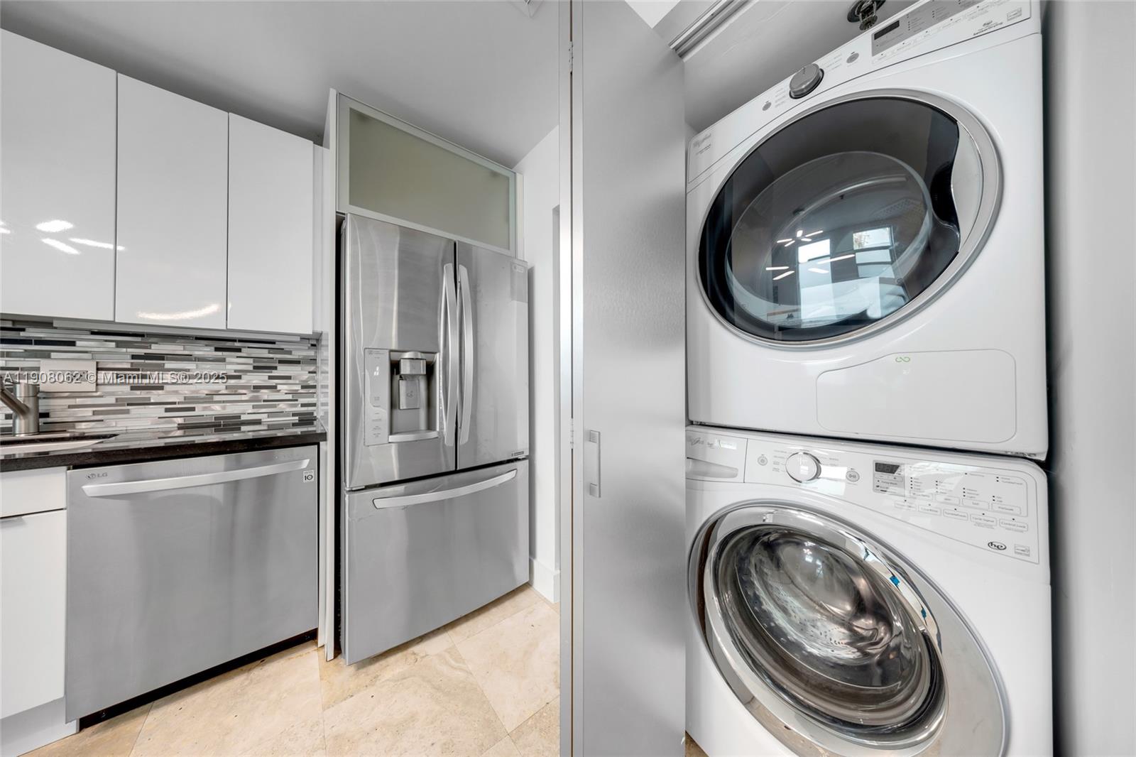 1545 Jefferson Avenue, Unit 103 Miami Beach, FL 33139 - Photo 12 of 35 a view of washer and dryer in a kitchen