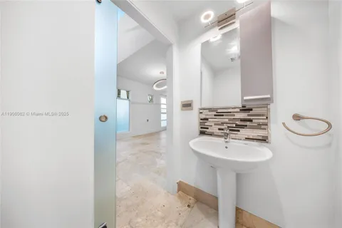 an empty room with closet and windows