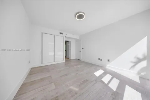 a bathroom with a double vanity sink mirror and shower