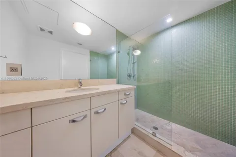 a view of a porch with furniture and floor to ceiling window