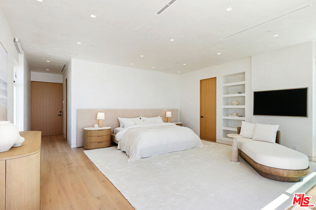 31224 Broad Beach Road Malibu, CA 90265 - Photo 27 of 54 a bedroom with a bed and a flat screen tv