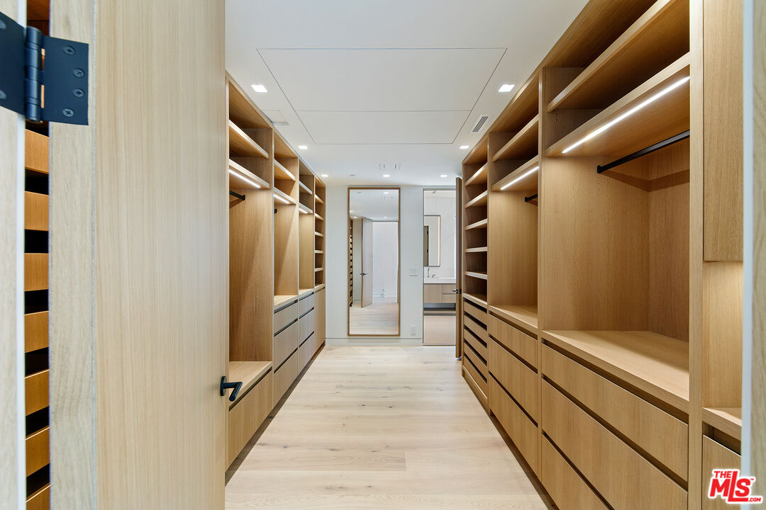 31224 Broad Beach Road Malibu, CA 90265 - Photo 30 of 54 a view of walk in closet with clothes