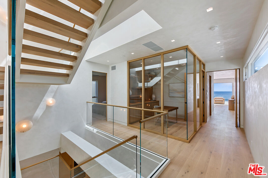 31224 Broad Beach Road Malibu, CA 90265 - Photo 31 of 54 a room with wooden floor and windows