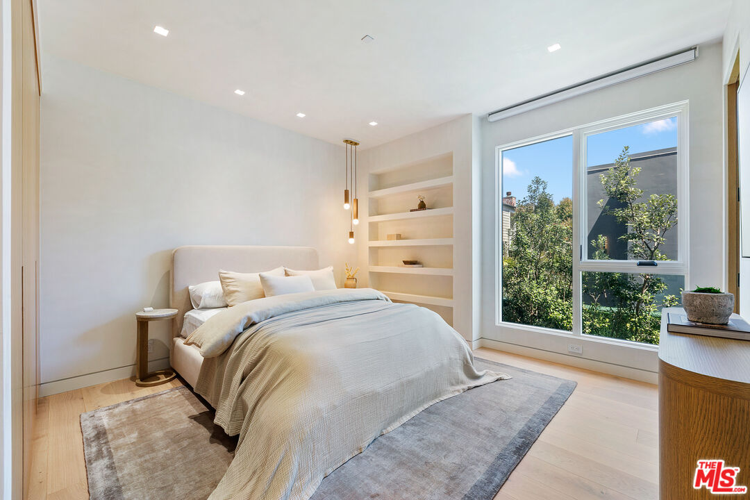 31224 Broad Beach Road Malibu, CA 90265 - Photo 33 of 54 a bedroom with a large bed and a large window