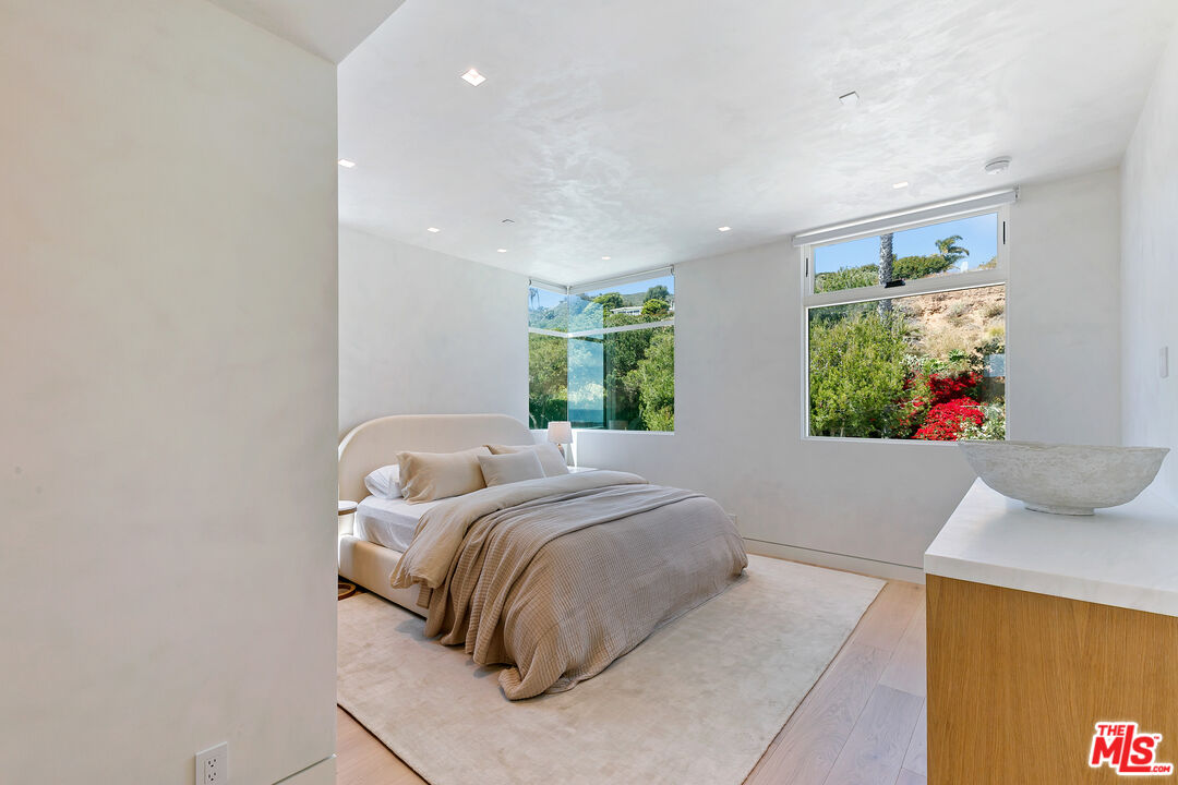 31224 Broad Beach Road Malibu, CA 90265 - Photo 43 of 54 a bedroom with a bed and a window