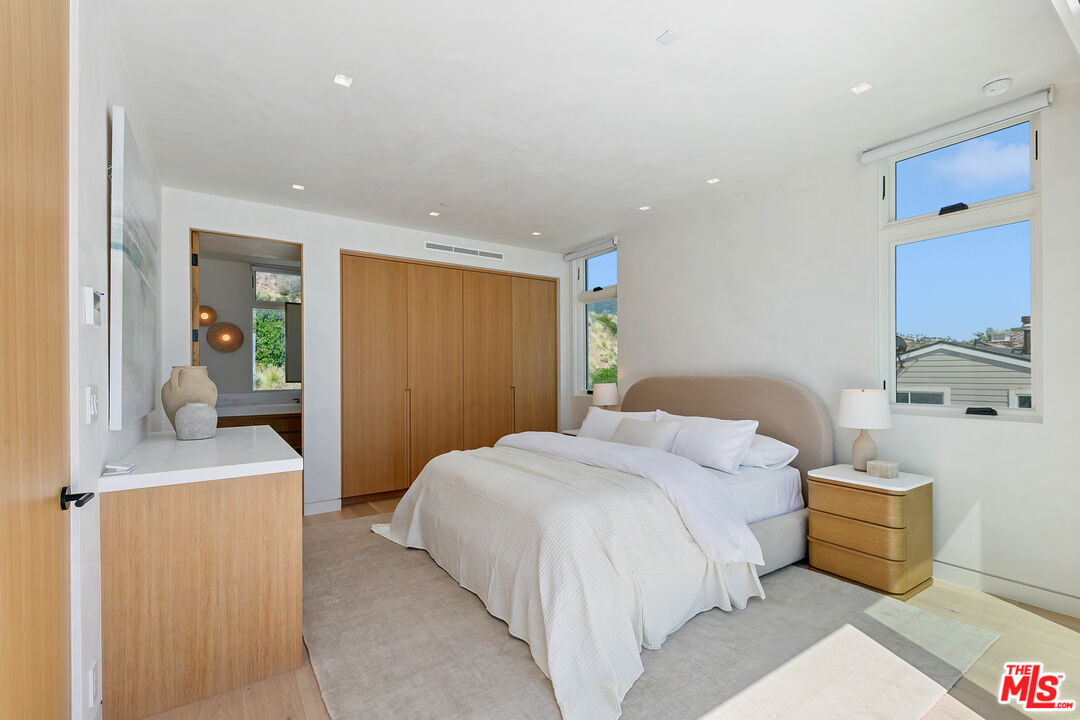 31224 Broad Beach Road Malibu, CA 90265 - Photo 46 of 54 a bedroom with a bed and a couch