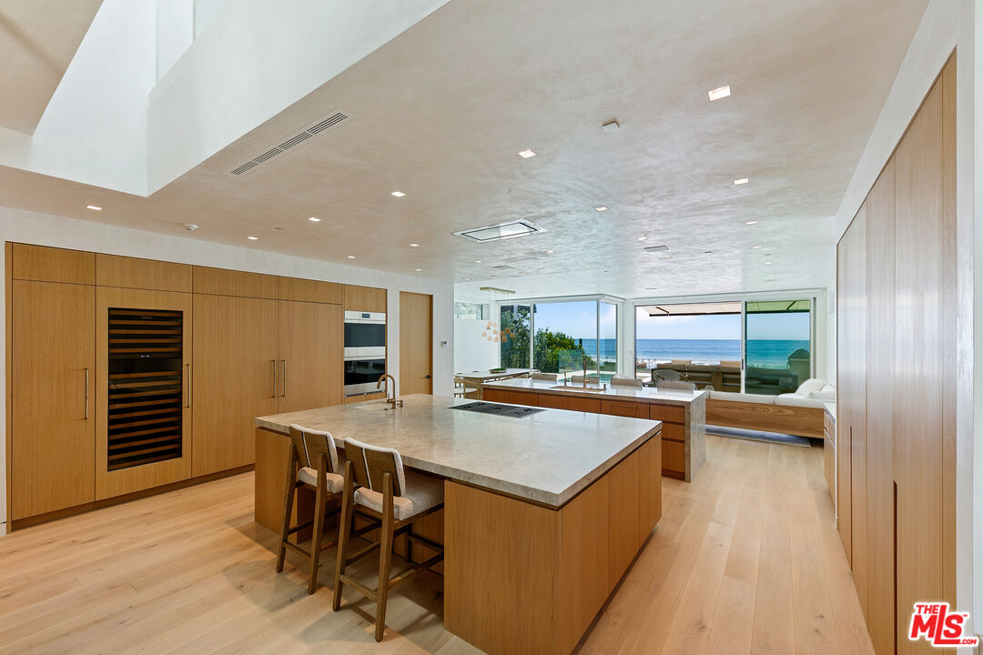 31224 Broad Beach Road Malibu, CA 90265 - Photo 8 of 54 a kitchen with a table and chairs in it