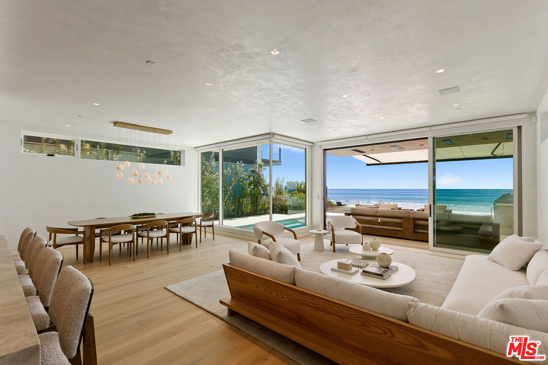 31224 Broad Beach Road Malibu, CA 90265 - Photo 10 of 54 a living room with furniture and large windows
