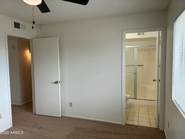 an empty room with closet area