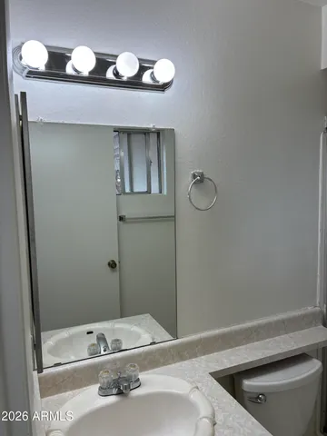 a bathroom with a tub and a sink