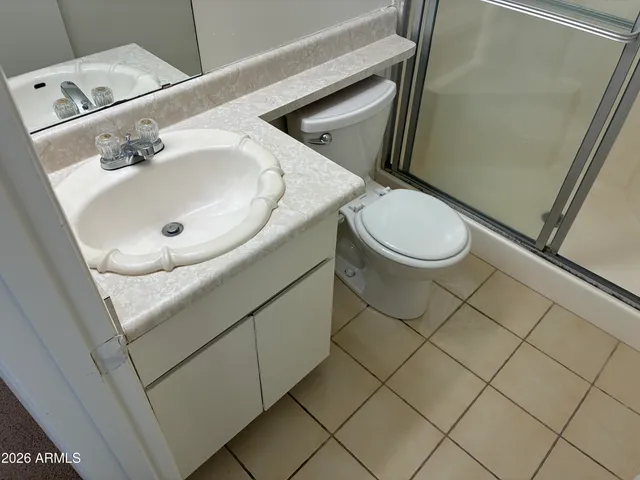 a bathroom with a sink and toilet