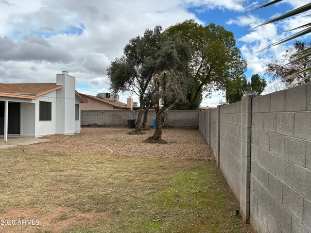 a view of backyard with green space
