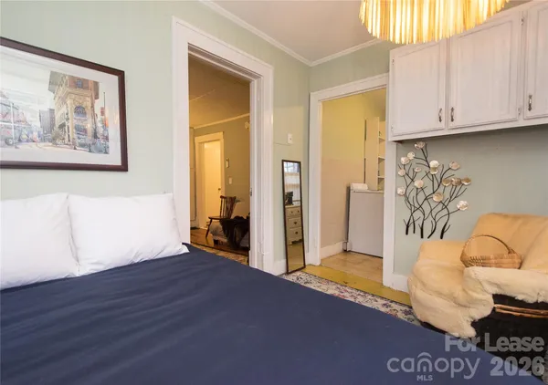 a view of livingroom with hardwood floor and cabinet