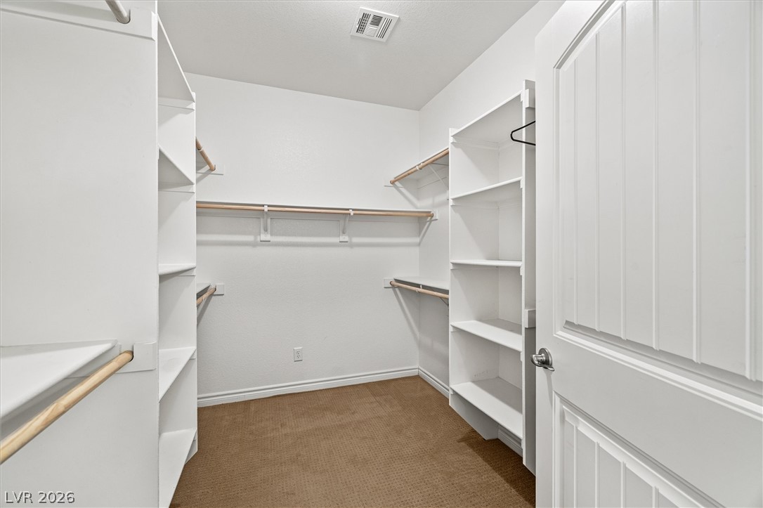 6720 Stubblefield Drive Pahrump, NV 89061 - Photo 32 of 51 Ample shelving and hanging space in this well-organized walk-in closet.