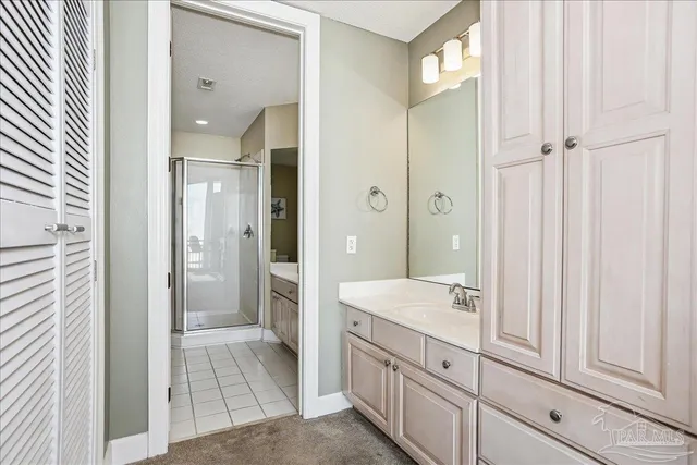 a spacious bathroom with a shower and a sink