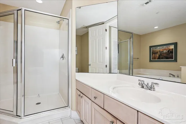 a bathroom with a granite countertop sink mirror and shower