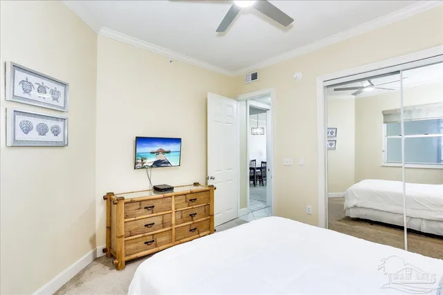 a bedroom with a bed and a view of bathroom