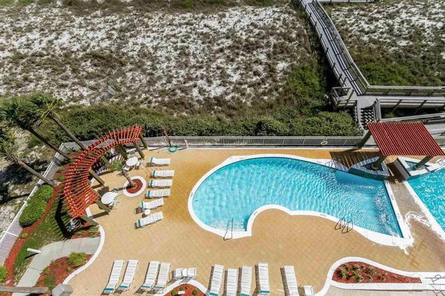 a view of swimming pool from a balcony