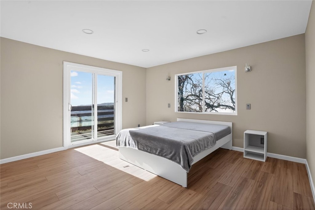 30420 Starland Drive Tehachapi, CA 93561 - Photo 11 of 30 a spacious bedroom with a bed and wooden floor