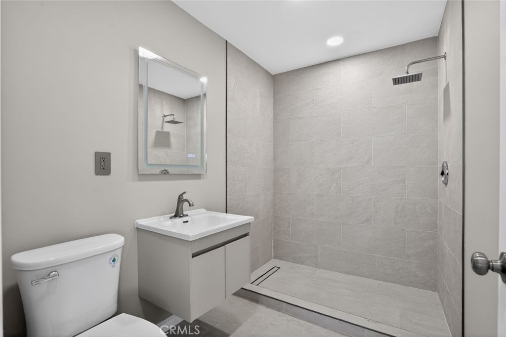 30420 Starland Drive Tehachapi, CA 93561 - Photo 19 of 30 a bathroom with a sink toilet and shower