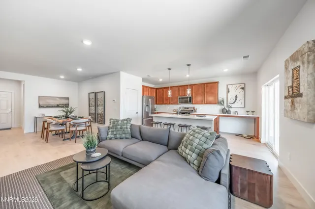 a bedroom with a bed and a potted plant