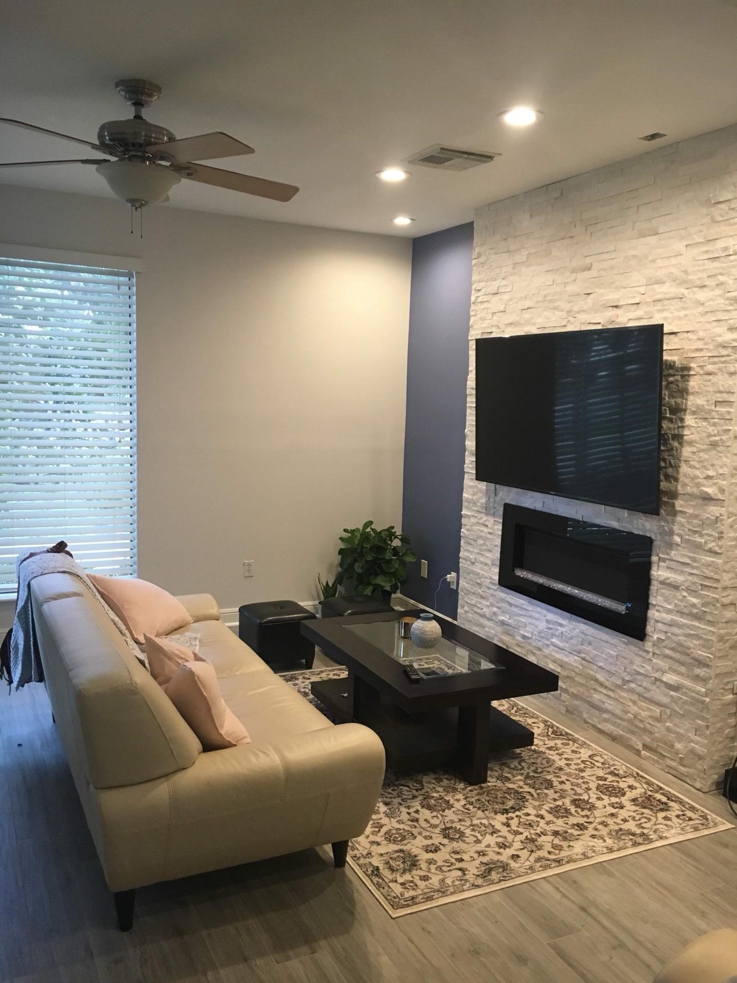 4502 Dickson Street Houston, TX 77007 - Photo 2 of 8 a living room with furniture and a flat screen tv