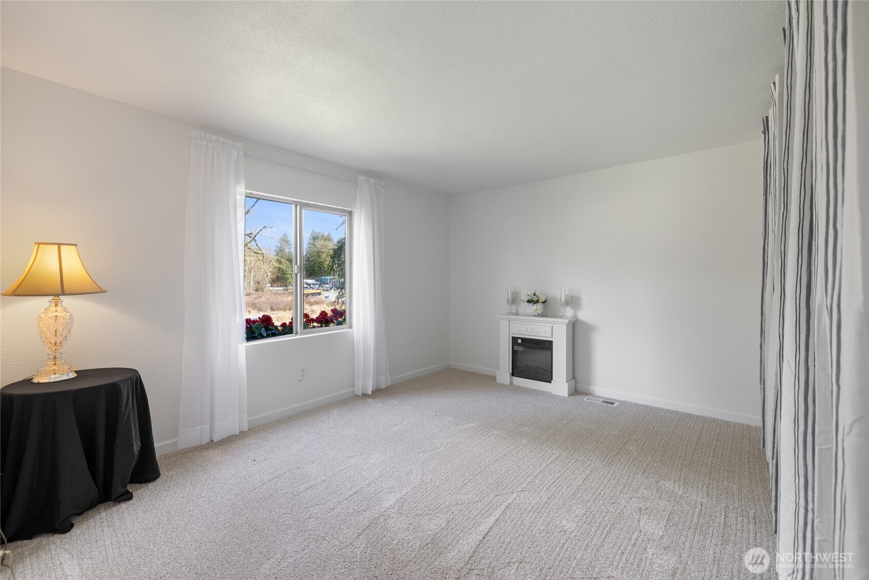 14512 246th Street East Graham, WA 98338 - Photo 16 of 39 a view of a livingroom with a fireplace