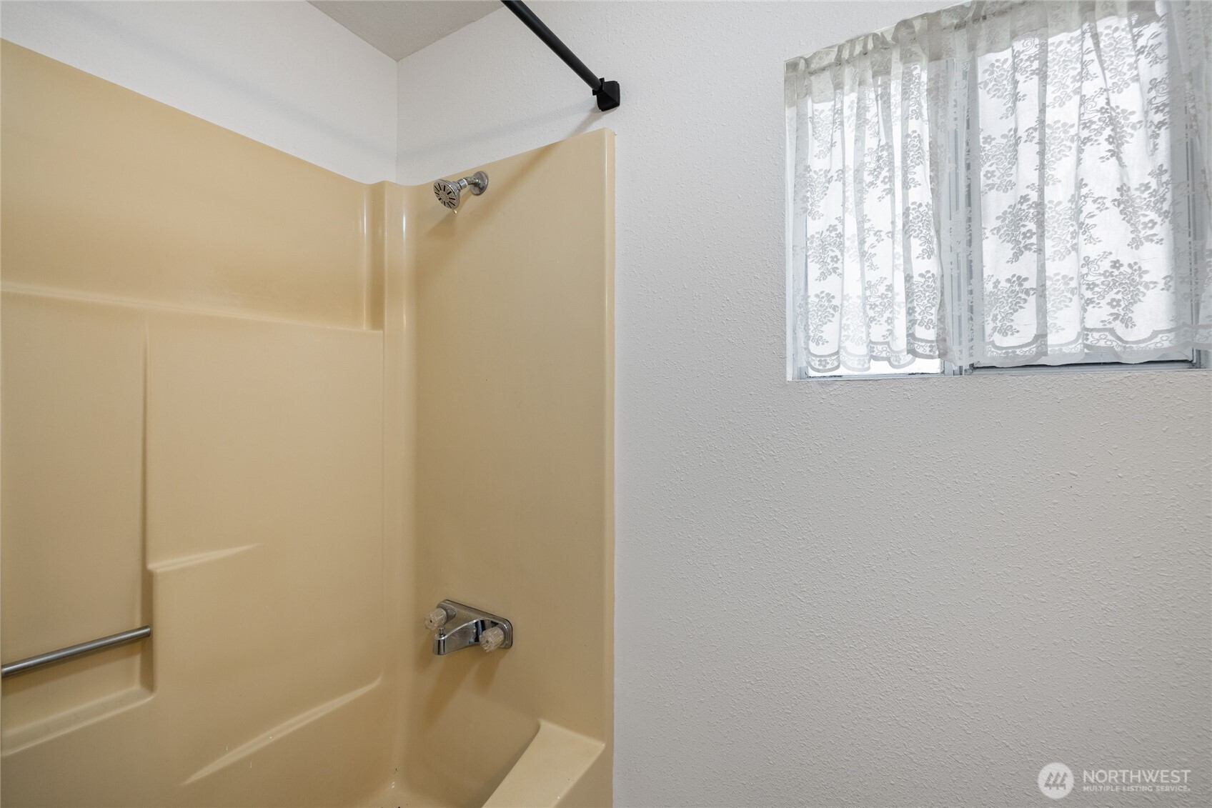 14512 246th Street East Graham, WA 98338 - Photo 21 of 39 a bathroom with a shower and a bathtub