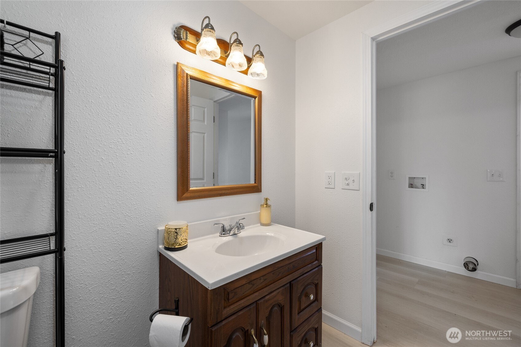 14512 246th Street East Graham, WA 98338 - Photo 22 of 39 a bathroom with a sink and a mirror