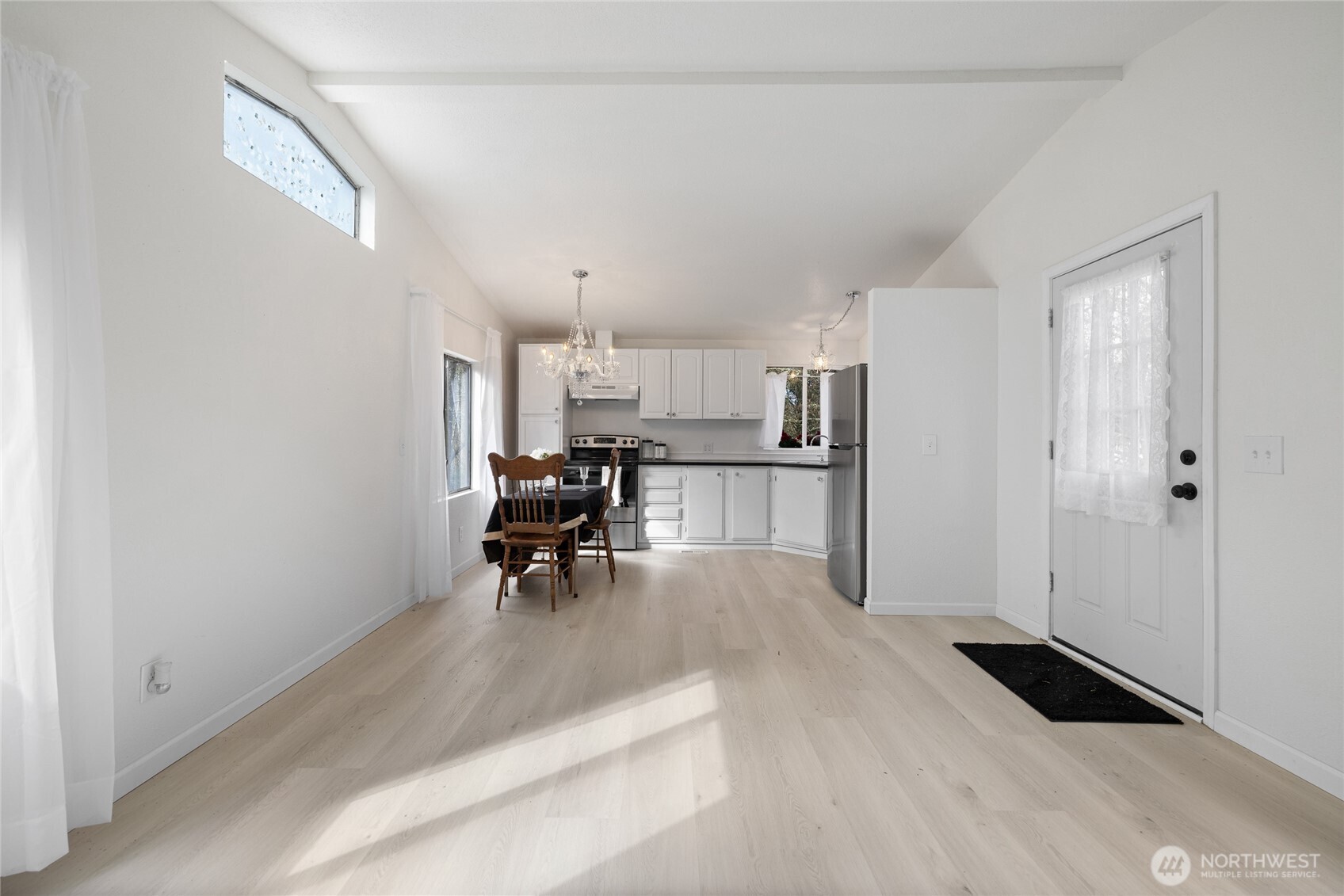 14512 246th Street East Graham, WA 98338 - Photo 5 of 39 a living room with furniture and a table