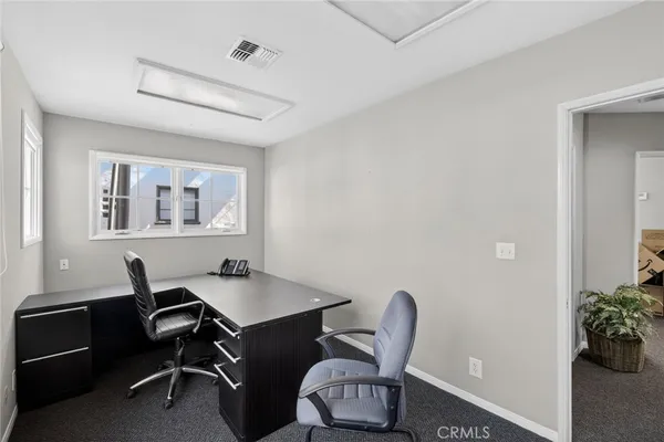 a workspace with furniture and window