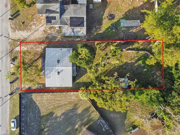 an aerial view of residential building and trees