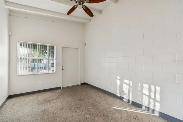 a view of empty room with windows