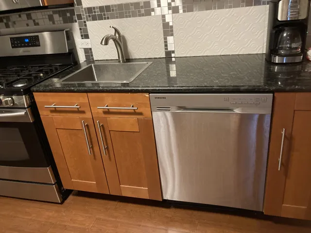 a close view of a stove a microwave and washer