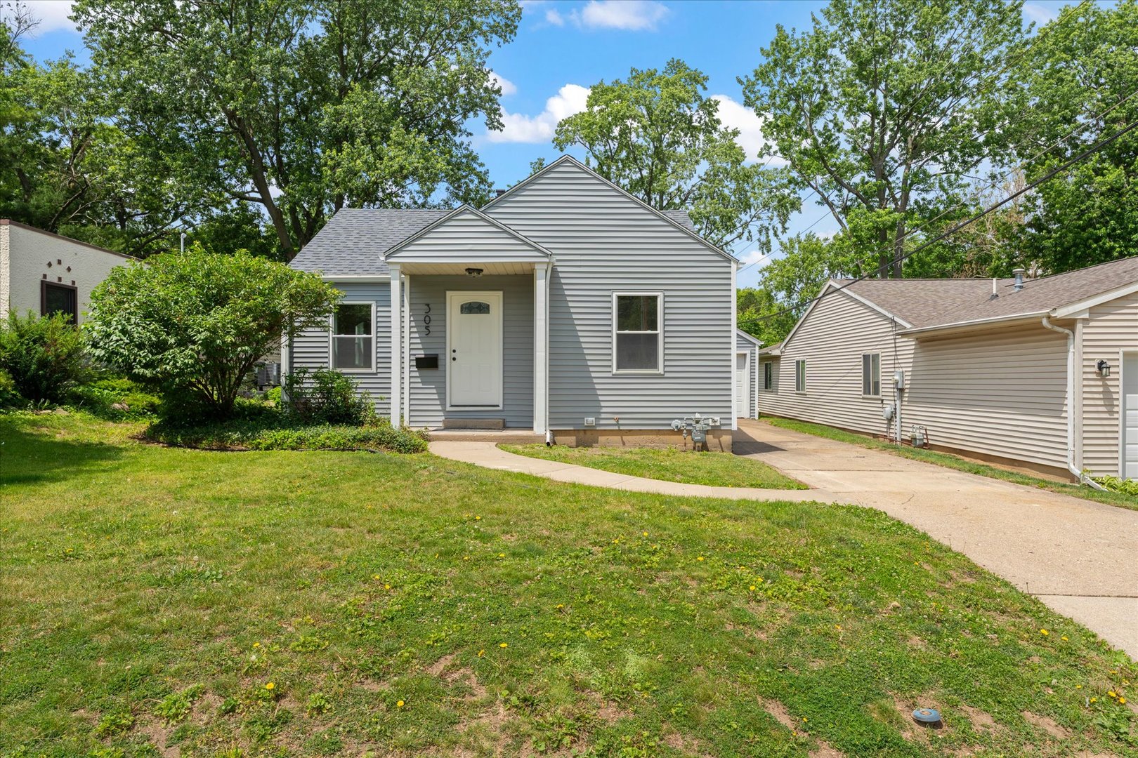 305 South Fair Street Champaign, IL 61821 - Photo 2 of 41 a front view of a house with a garden