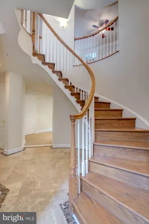 an empty room with windows fireplace and windows