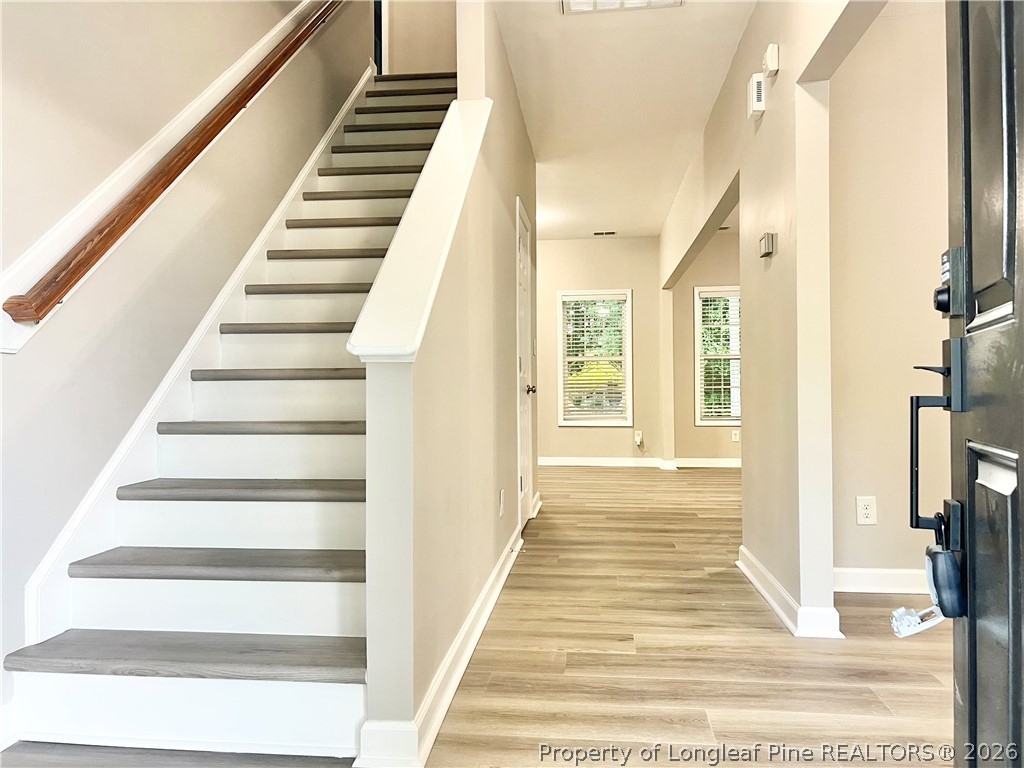 1523 Rough Rider Lane Parkton, NC 28371 - Photo 2 of 42 a view of entryway and hall with wooden floor