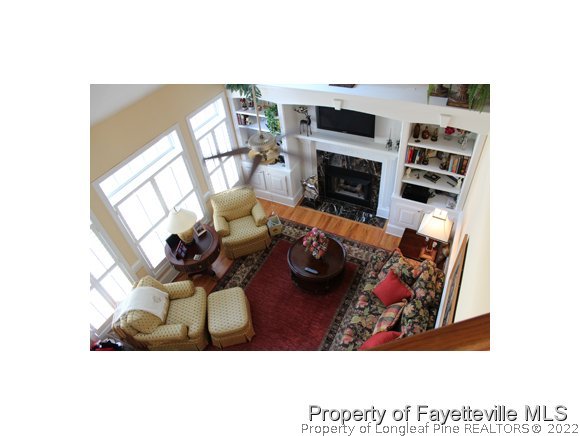 1816 Morganton Road Fayetteville, NC 28305 - Photo 5 of 24 a view of a livingroom and a fireplace with furniture