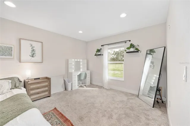 a view of a house with swimming pool yard and sitting area