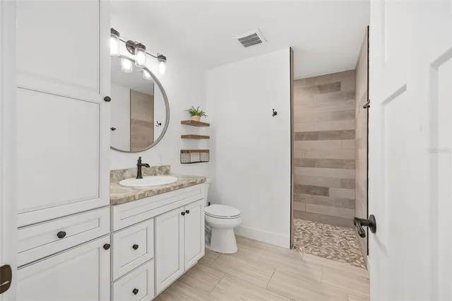 a front view of a house with a big yard